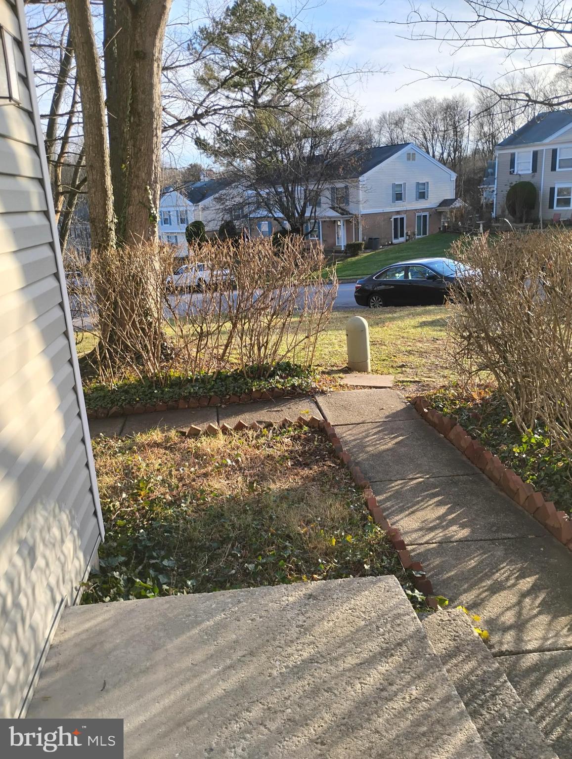 6 Ridgelawn Road, Unit C Reisterstown, MD 21136 - Photo 5 of 28 a view of a street with a building in the background