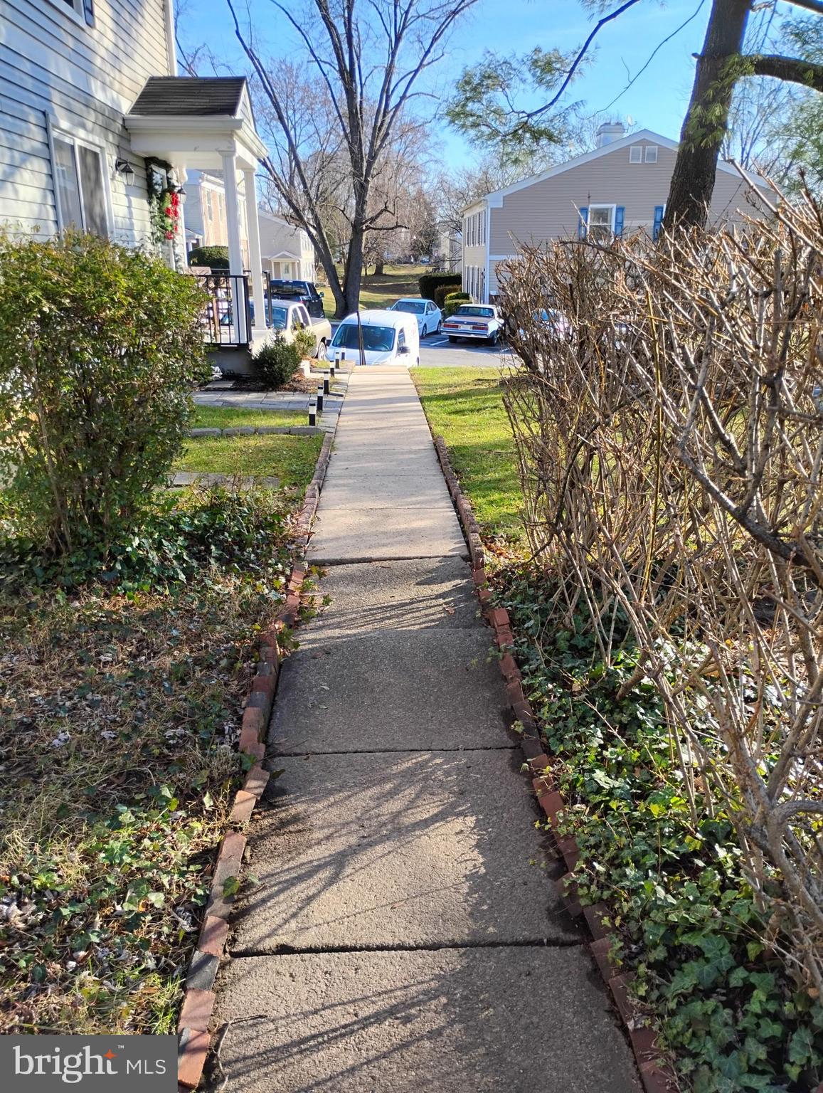 6 Ridgelawn Road, Unit C Reisterstown, MD 21136 - Photo 8 of 28 a view of a yard with plants and trees