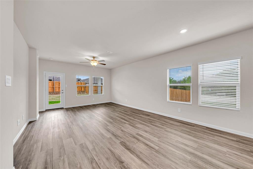 417 Martell Road Lowry Crossing, TX 75069 - Photo 12 of 29 wooden floor in an empty room with a window