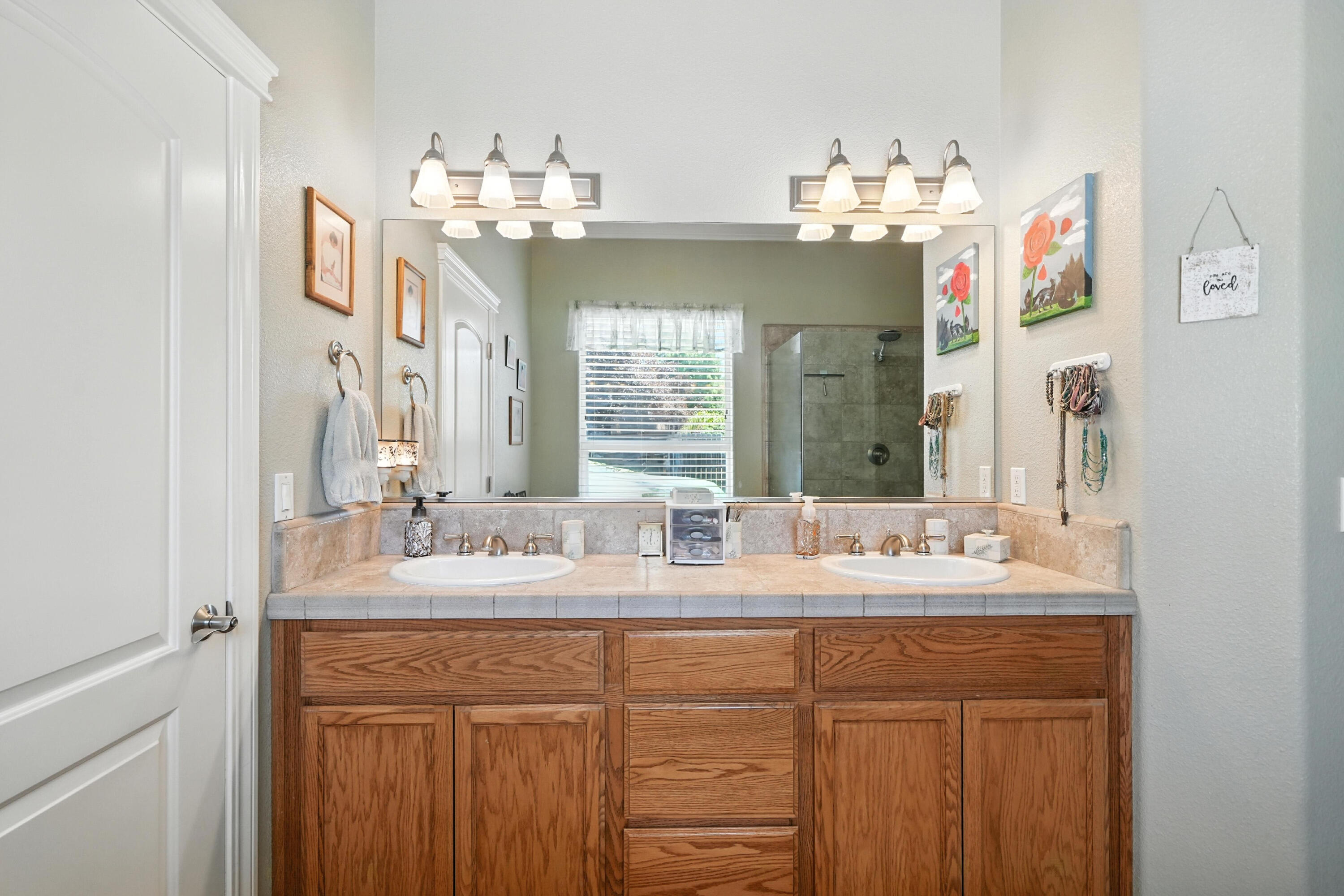 7777 Pit Road Redding, CA 96001 - Photo 12 of 27 a bathroom with a sink double vanity and a mirror