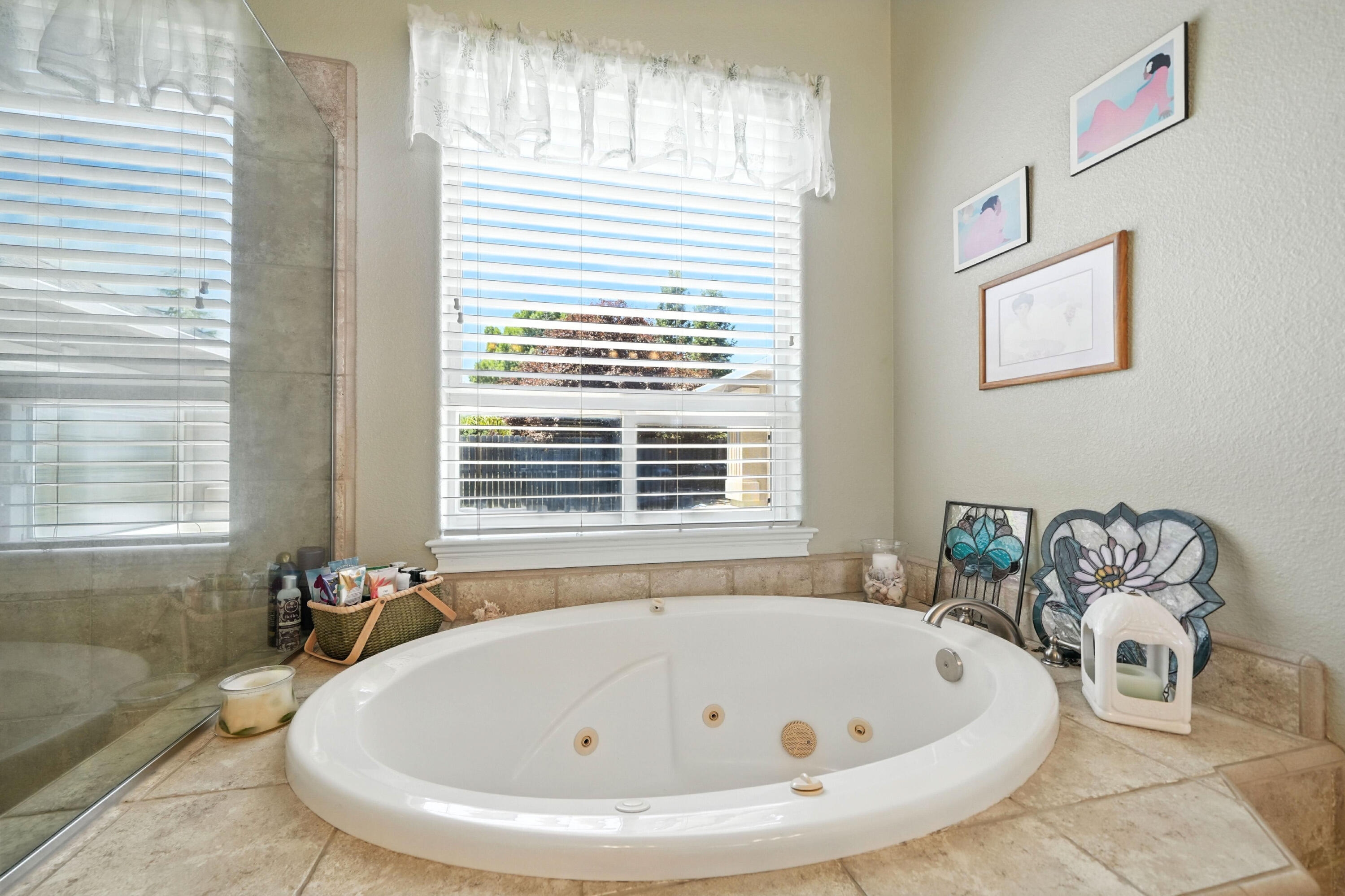 7777 Pit Road Redding, CA 96001 - Photo 13 of 27 a white bath tub sitting in a bathroom next to a window