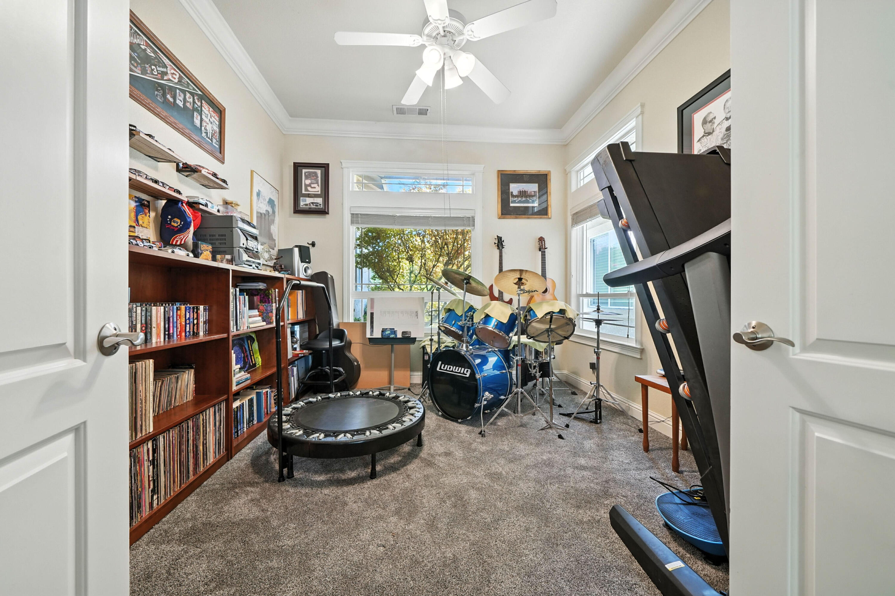 7777 Pit Road Redding, CA 96001 - Photo 15 of 27 a living room with furniture a bookshelf and a window