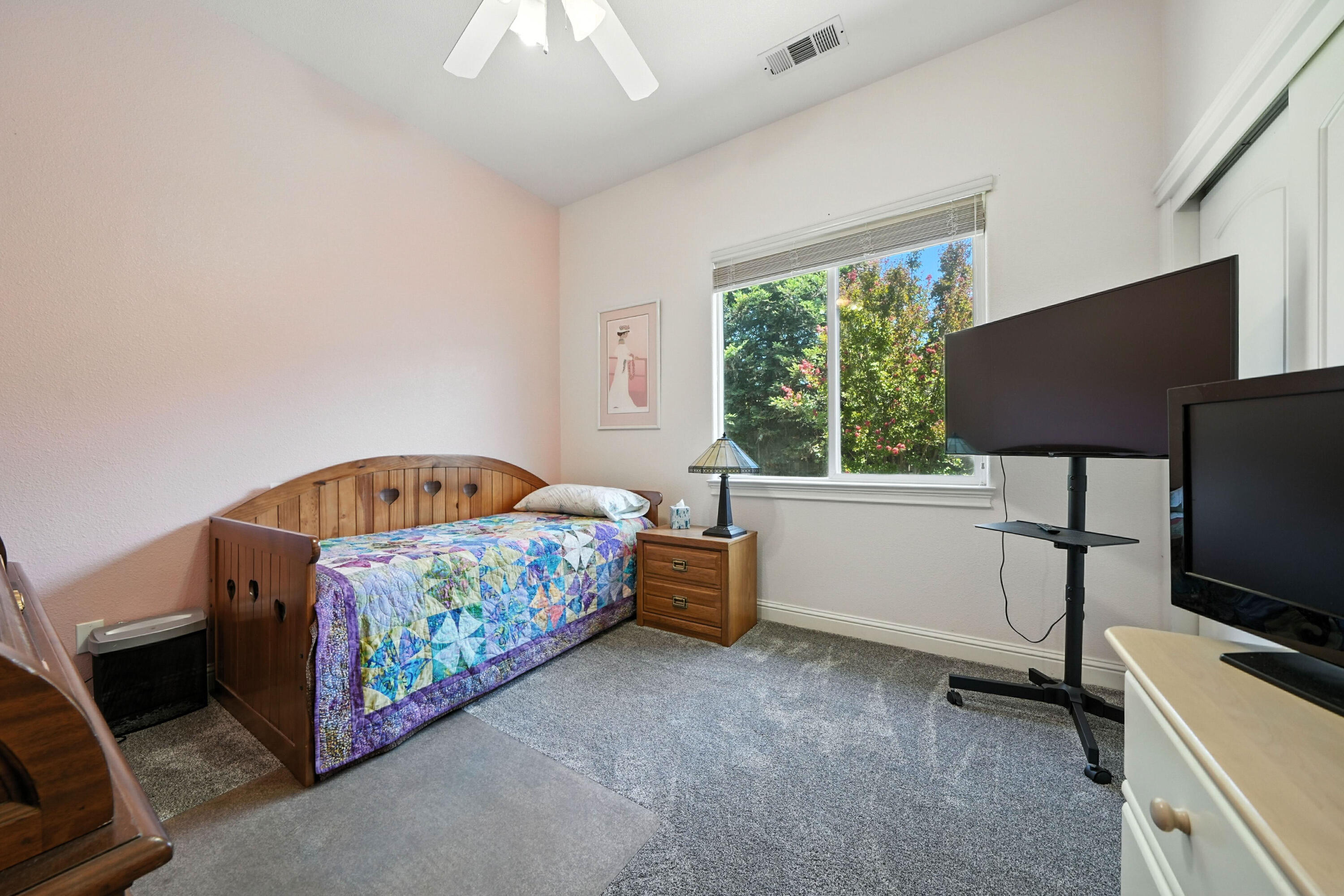 7777 Pit Road Redding, CA 96001 - Photo 16 of 27 a bedroom with a bed and a tv