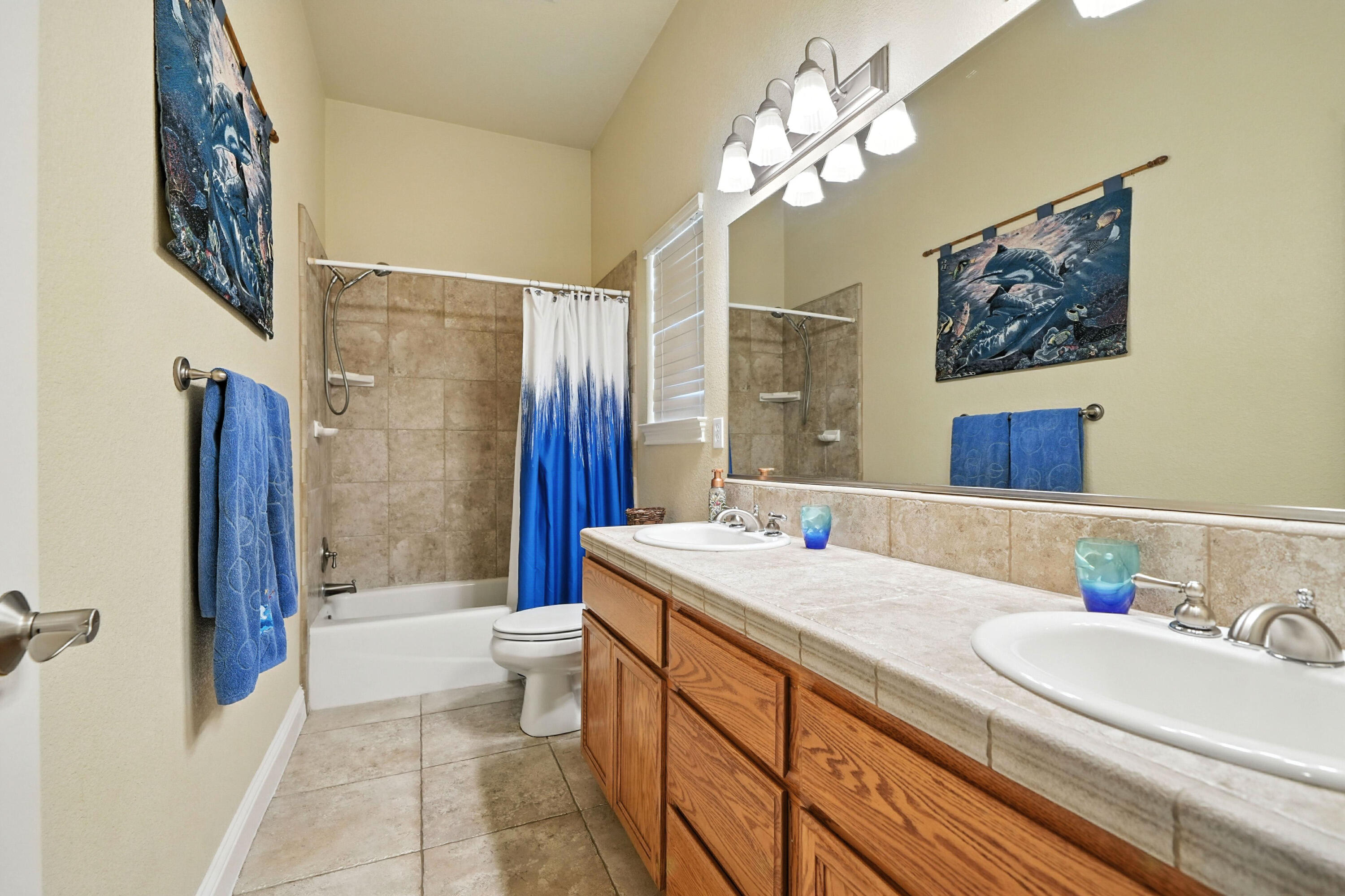 7777 Pit Road Redding, CA 96001 - Photo 18 of 27 a bathroom with a double vanity sink mirror and shower