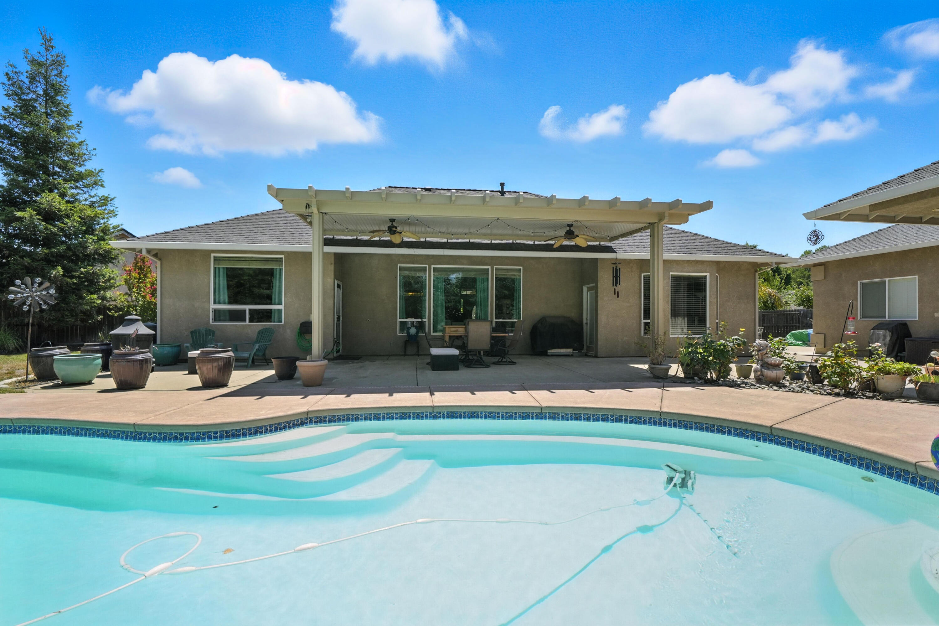 7777 Pit Road Redding, CA 96001 - Photo 2 of 27 a view of a house with dining space and a garden