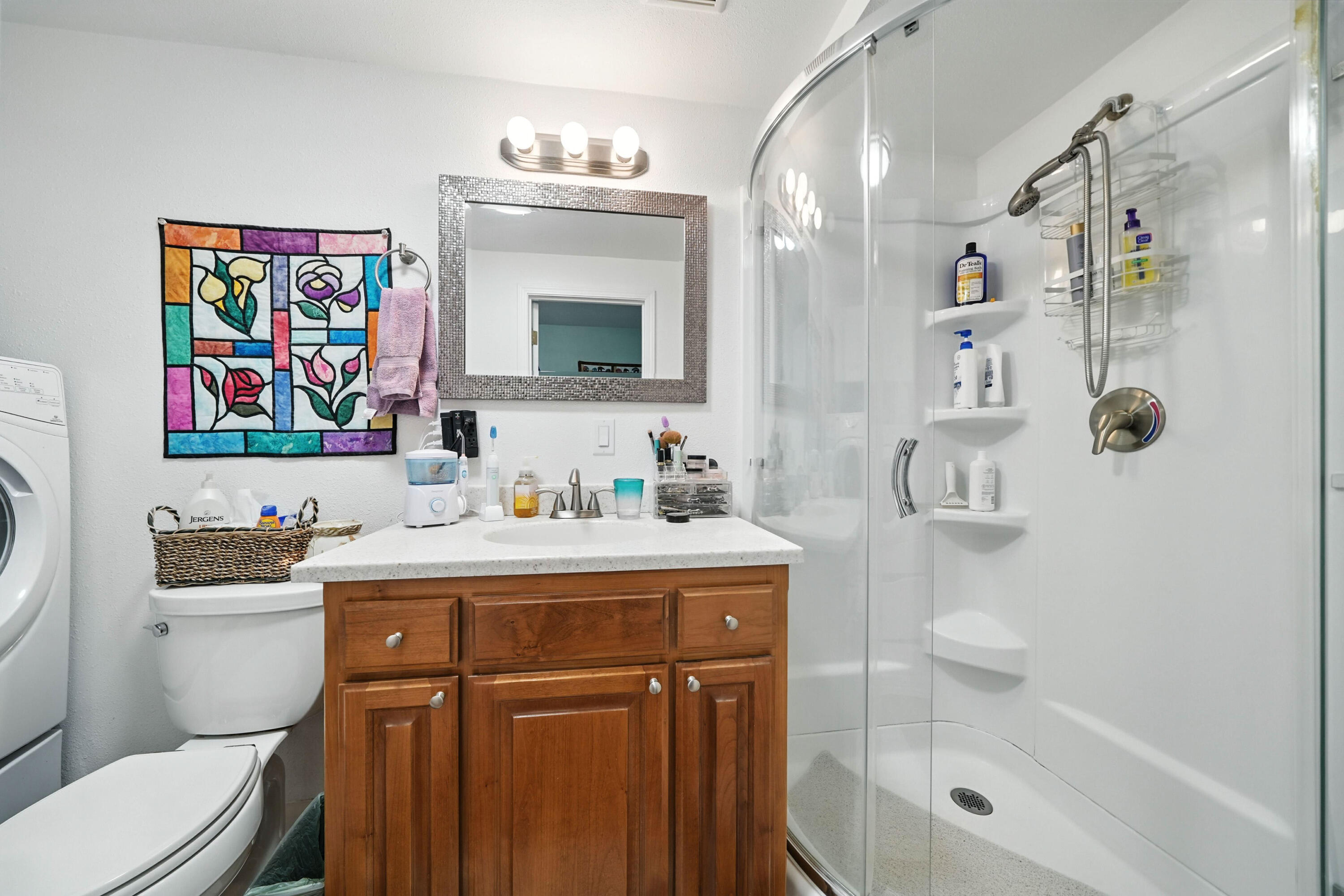 7777 Pit Road Redding, CA 96001 - Photo 23 of 27 a bathroom with a sink a toilet and shower