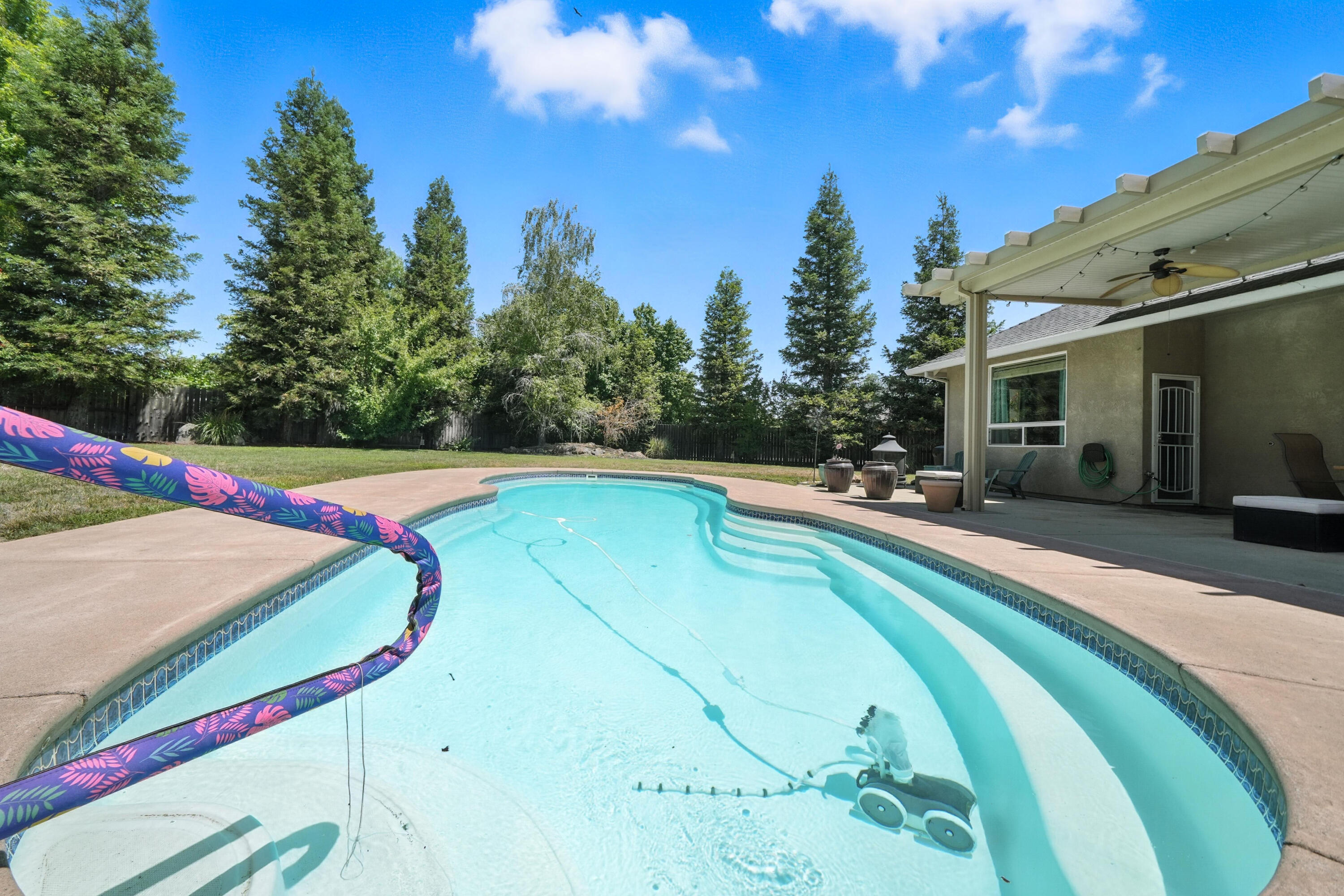7777 Pit Road Redding, CA 96001 - Photo 27 of 27 a view of a swimming pool with a yard