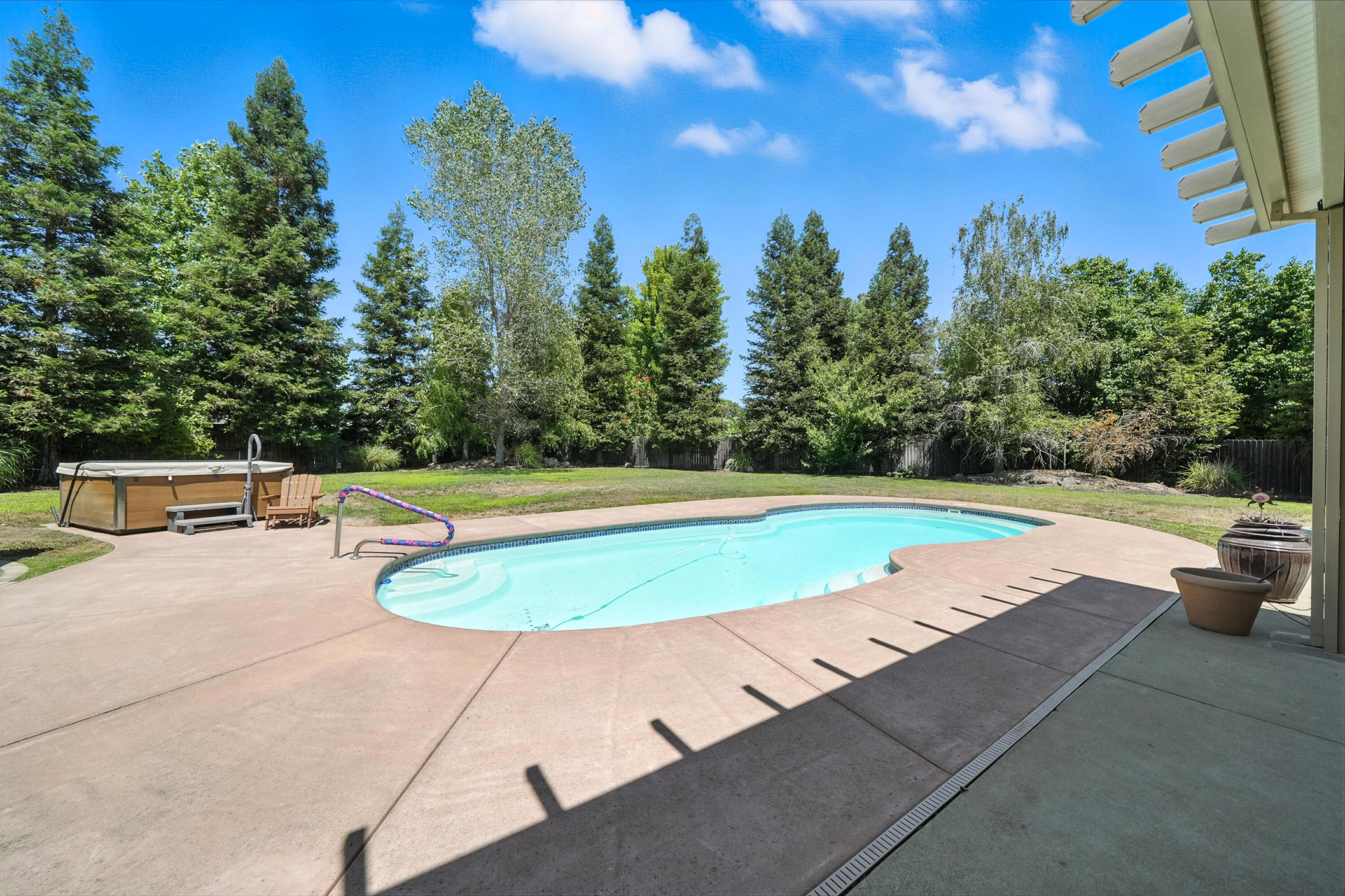 7777 Pit Road Redding, CA 96001 - Photo 3 of 27 a view of a swimming pool with a yard