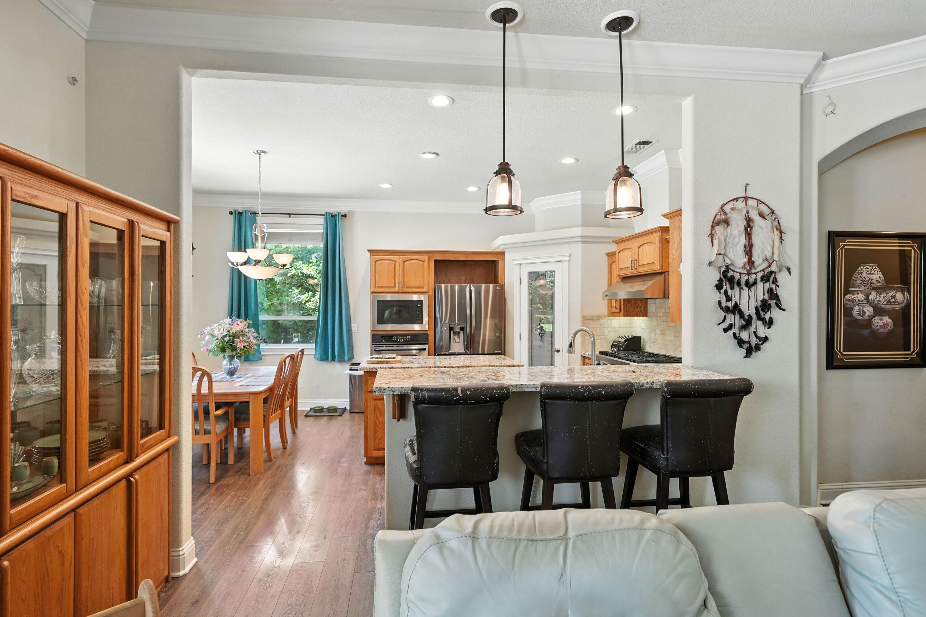 7777 Pit Road Redding, CA 96001 - Photo 6 of 27 a view of a dining room with furniture window and wooden floor