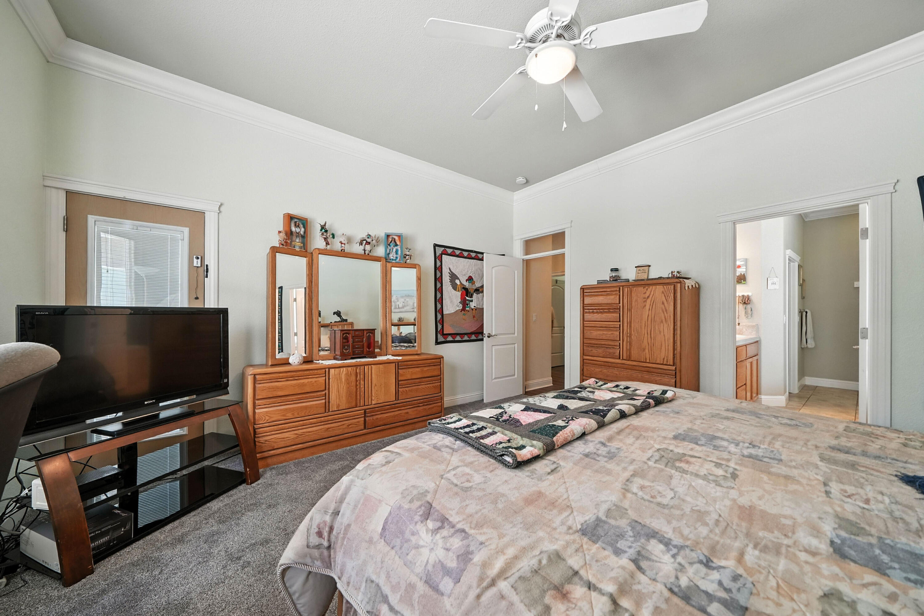 7777 Pit Road Redding, CA 96001 - Photo 10 of 27 a bedroom with a bed and a flat screen tv
