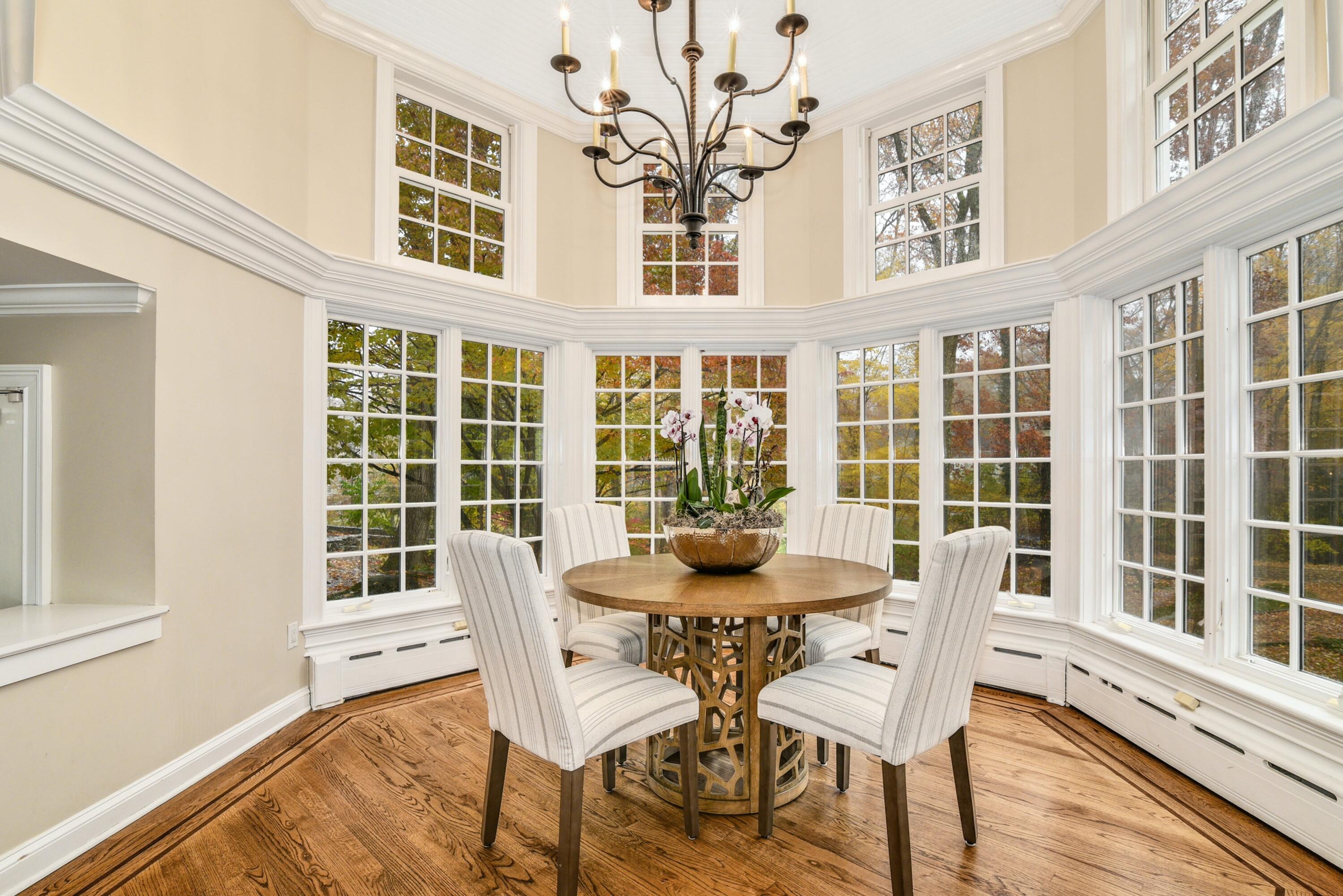 22 Stony Brook Road Darien, CT 06820 - Photo 13 of 33 a view of a dining room with furniture windows and wooden floor