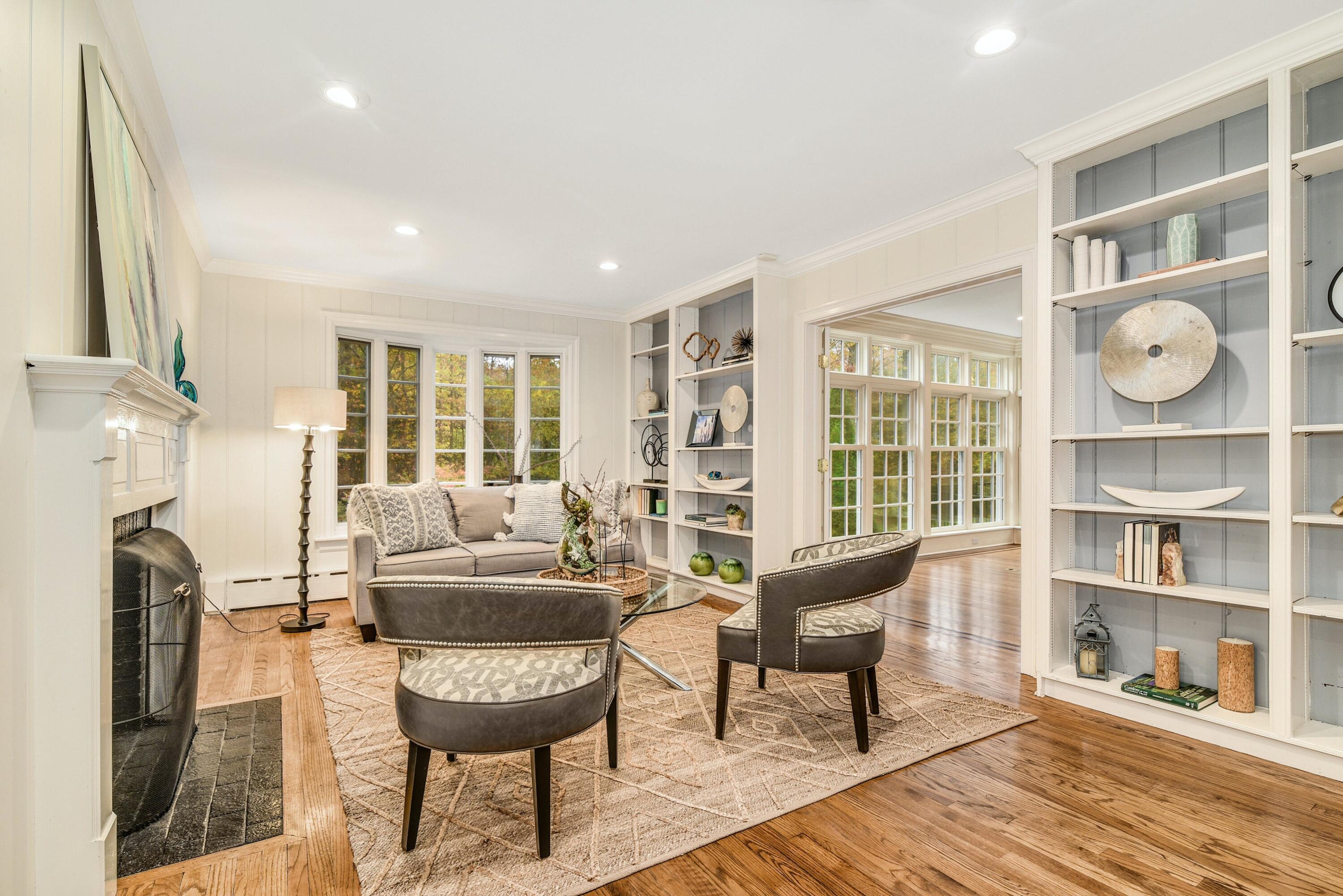 22 Stony Brook Road Darien, CT 06820 - Photo 15 of 33 a living room with furniture and a floor to ceiling window