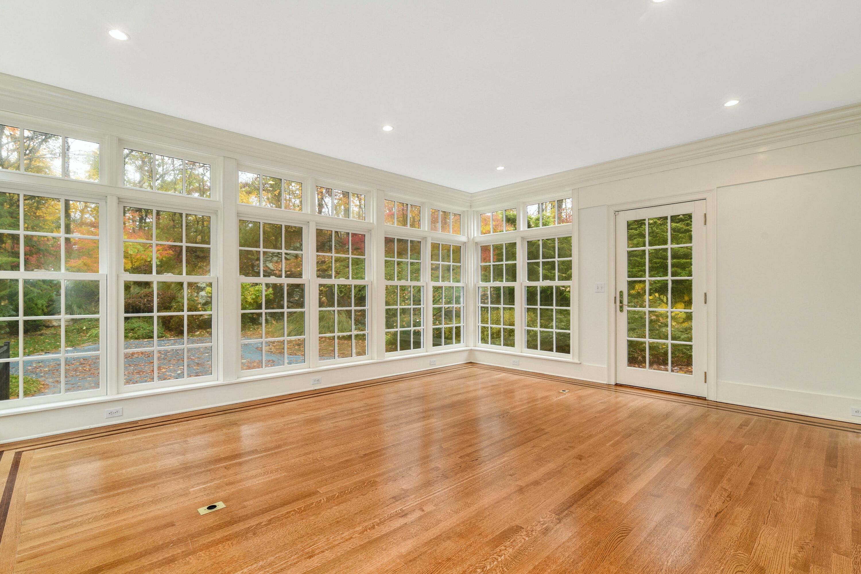 22 Stony Brook Road Darien, CT 06820 - Photo 18 of 33 a view of an empty room with a window and wooden floor