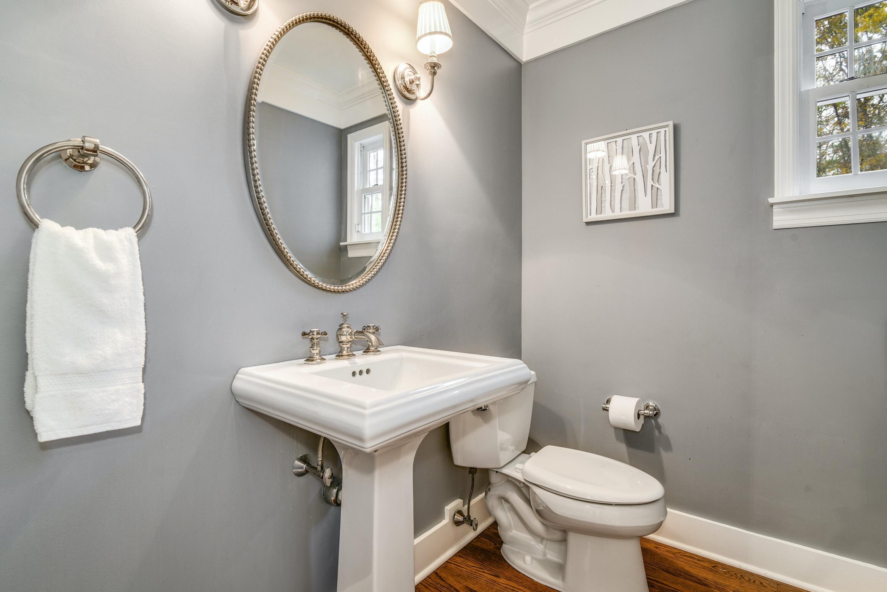 22 Stony Brook Road Darien, CT 06820 - Photo 20 of 33 a bathroom with a toilet sink and mirror