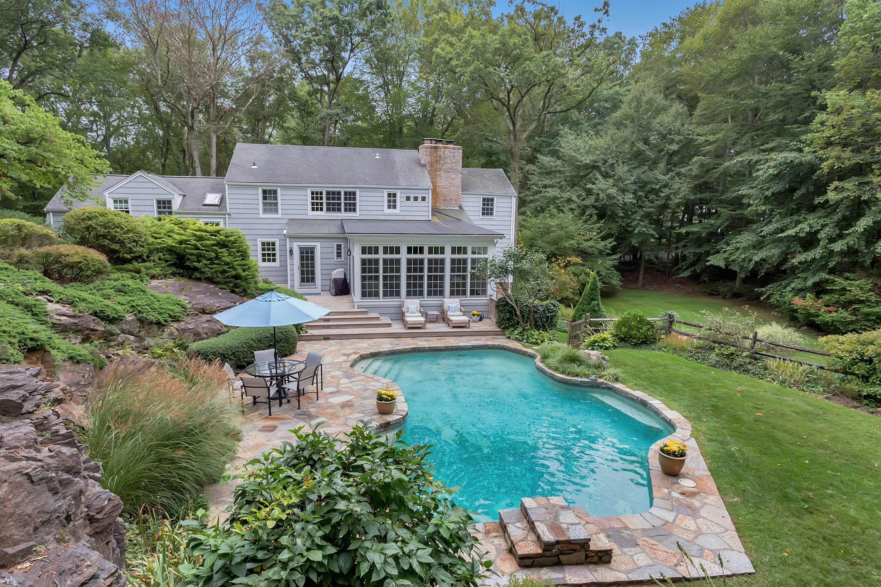 22 Stony Brook Road Darien, CT 06820 - Photo 2 of 33 an aerial view of a house with swimming pool patio and outdoor seating