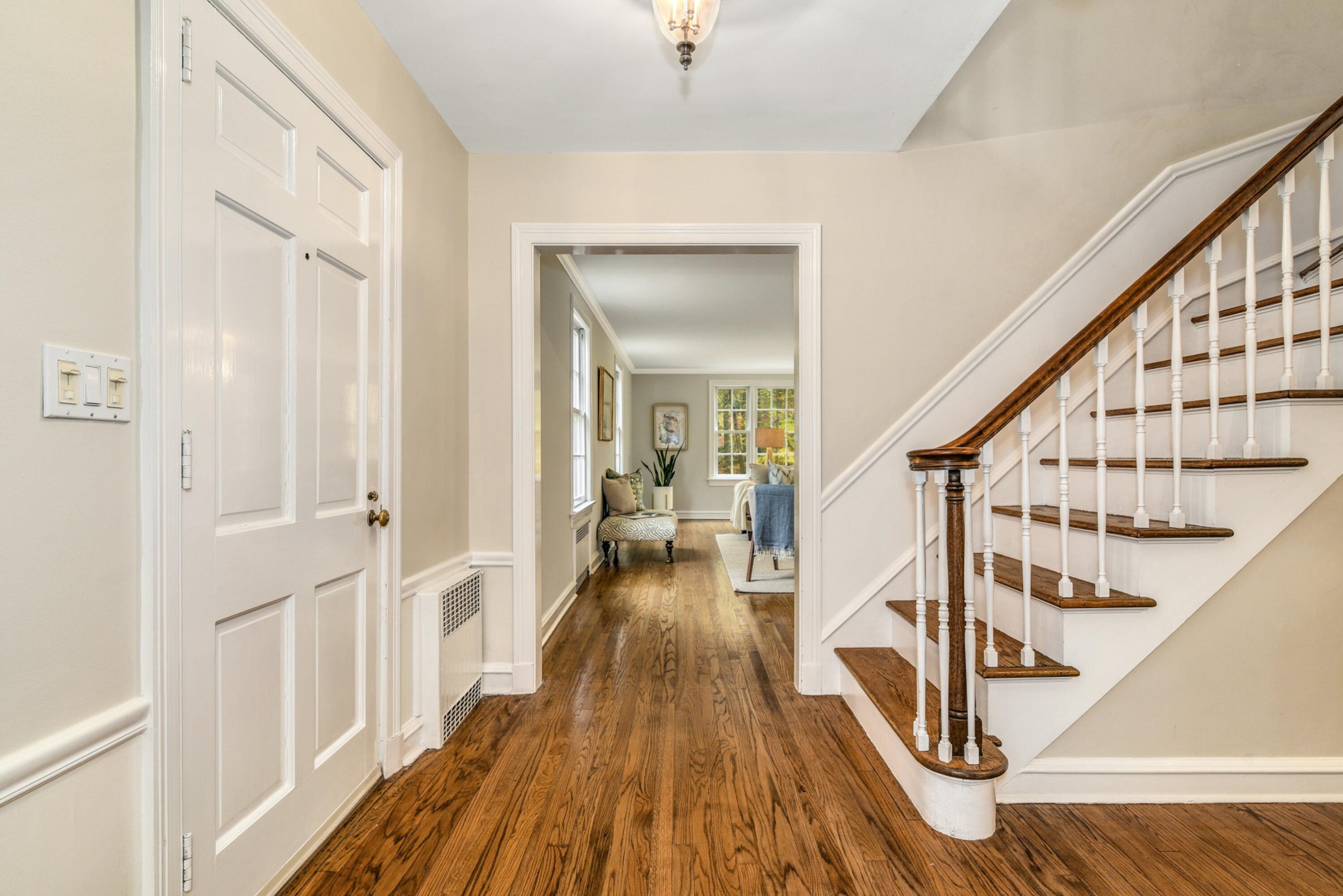 22 Stony Brook Road Darien, CT 06820 - Photo 21 of 33 a view of front door with wooden floor and stairs