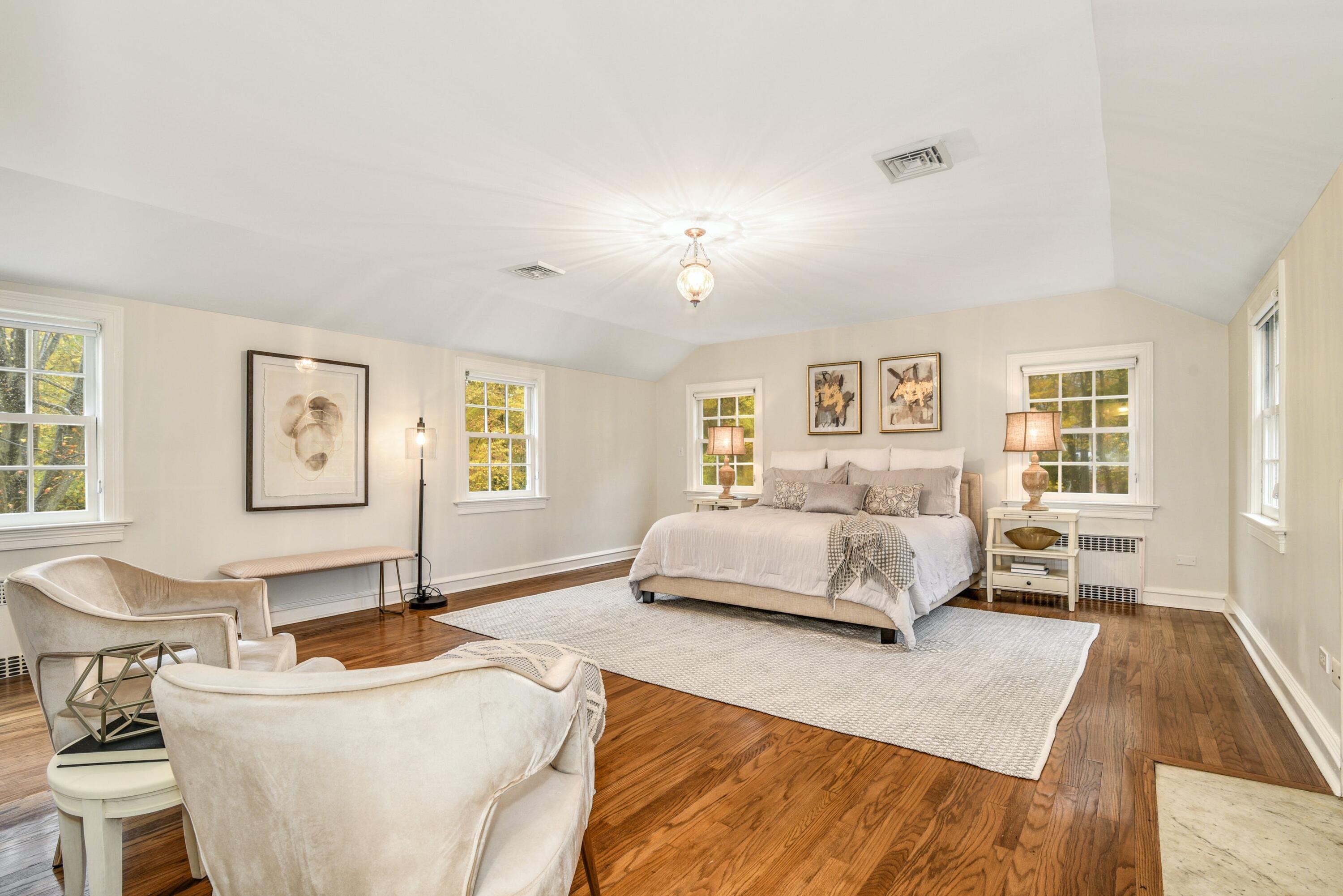 22 Stony Brook Road Darien, CT 06820 - Photo 23 of 33 a bedroom with a bed and wooden floor