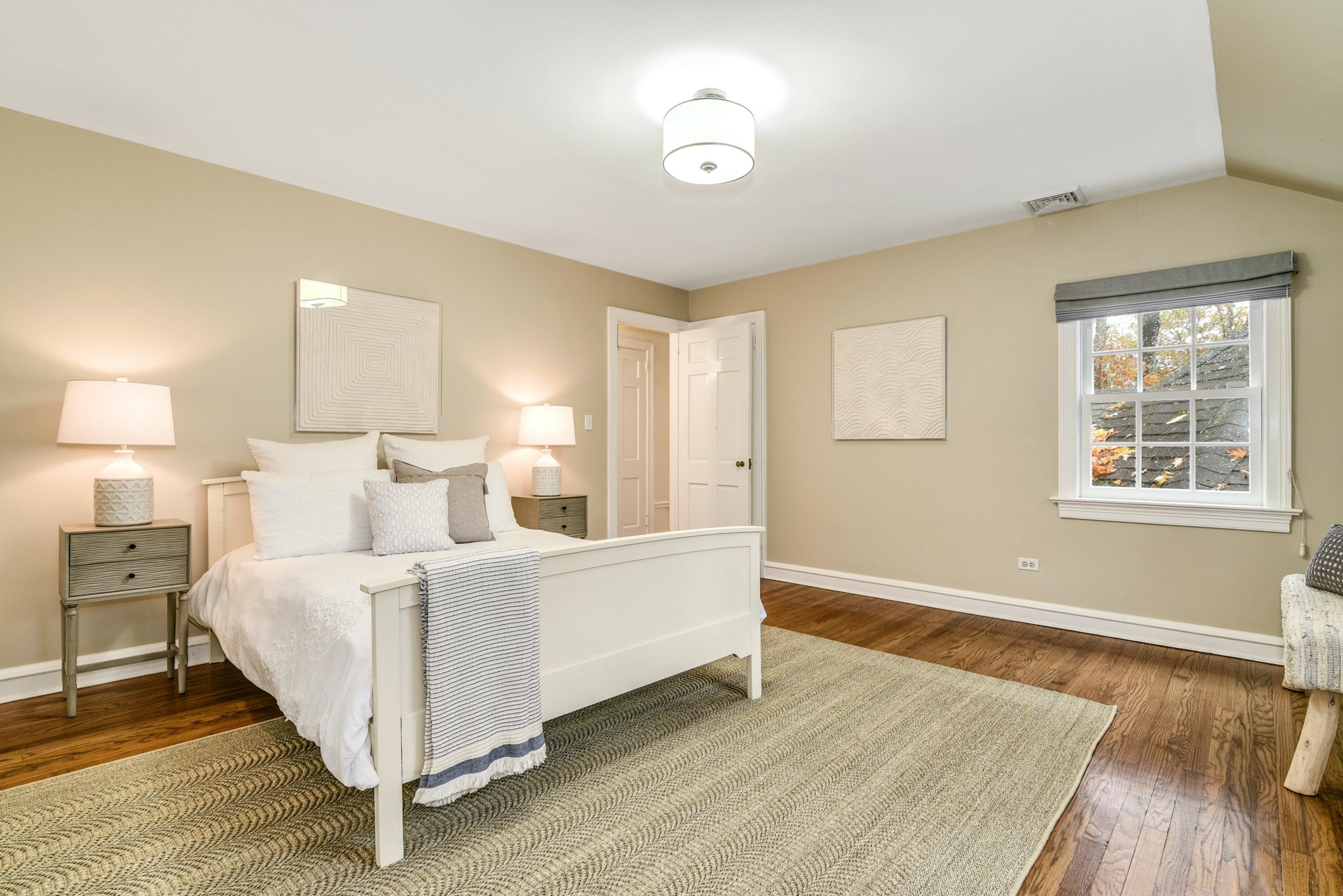 22 Stony Brook Road Darien, CT 06820 - Photo 25 of 33 a living room with a bed furniture and a window