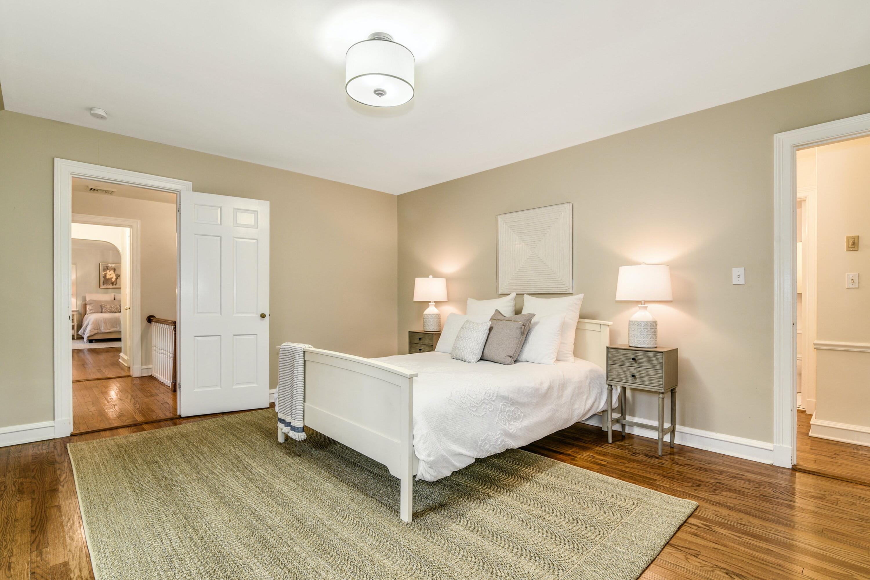 22 Stony Brook Road Darien, CT 06820 - Photo 26 of 33 a bedroom with a bed and wooden floor