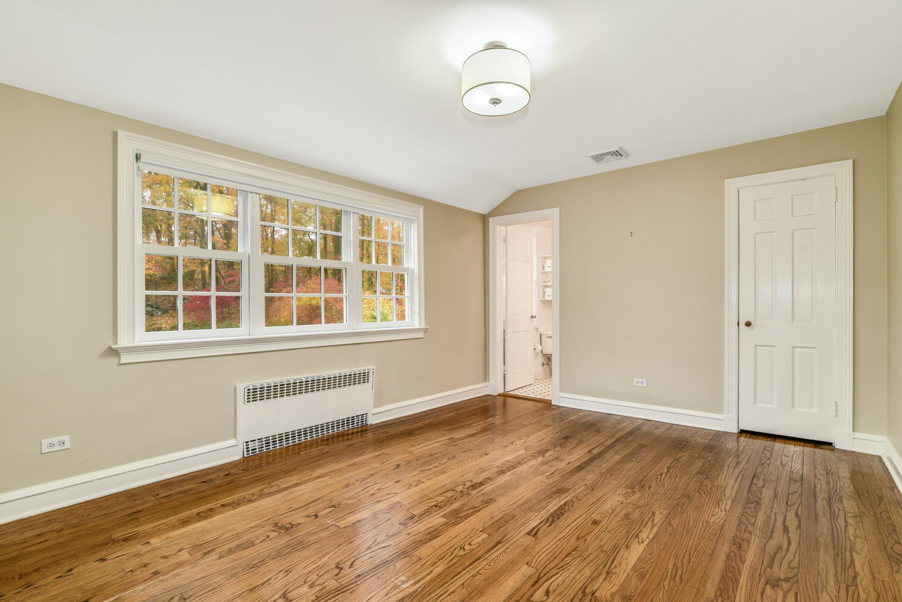 22 Stony Brook Road Darien, CT 06820 - Photo 27 of 33 a view of an empty room with wooden floor and a window