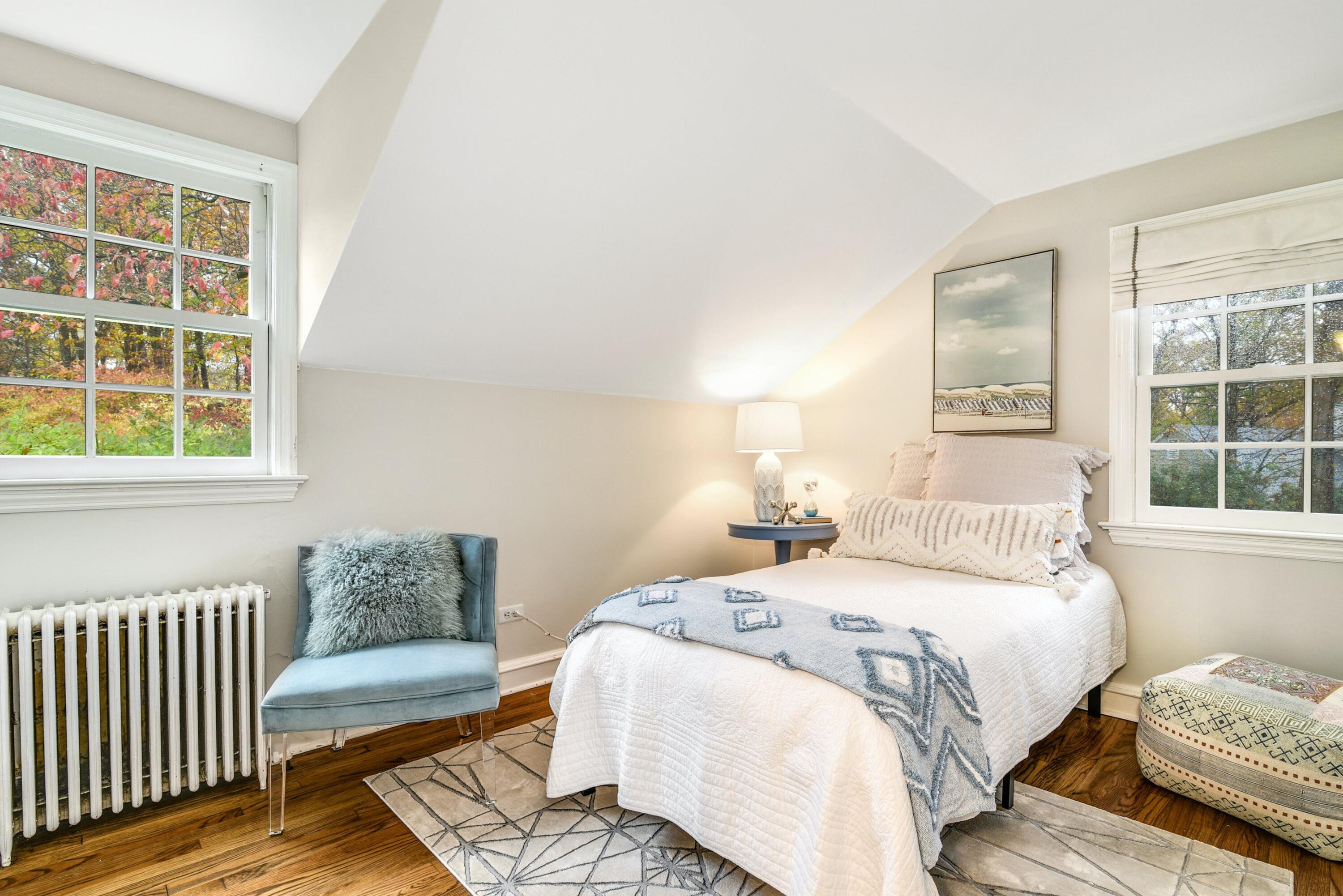 22 Stony Brook Road Darien, CT 06820 - Photo 28 of 33 a bedroom with a bed and wooden floor