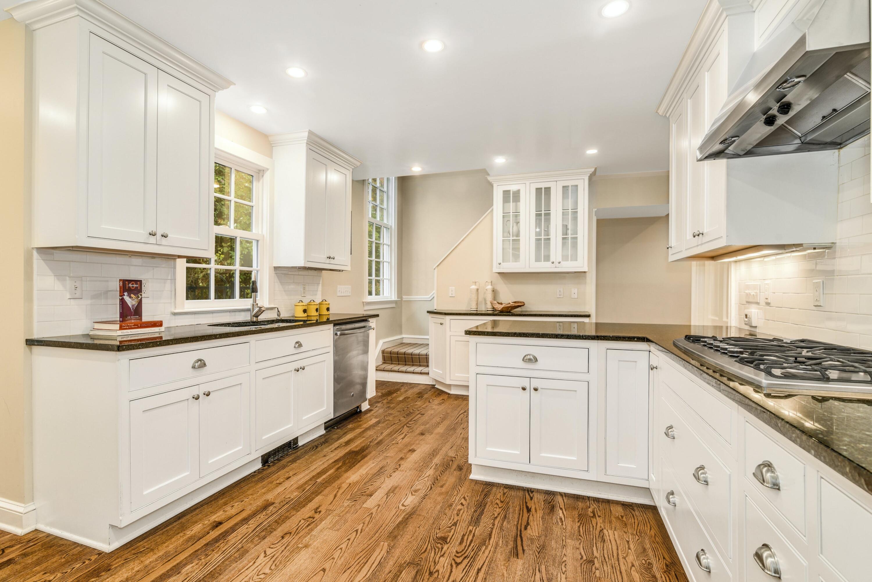 22 Stony Brook Road Darien, CT 06820 - Photo 10 of 33 a kitchen with granite countertop white cabinets and white appliances