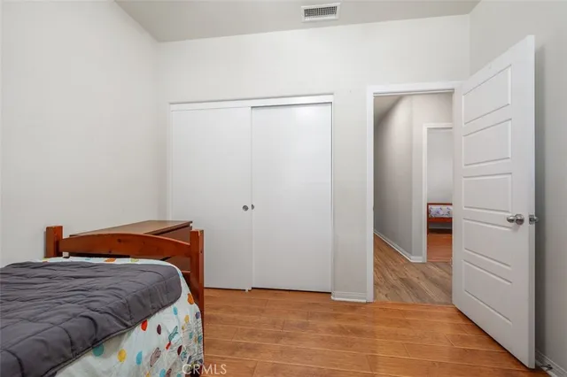 a bedroom with a bed and a walk in closet