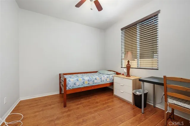 a room with pool table and windows