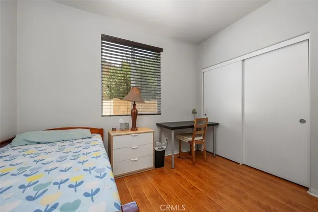 a bedroom with a bed and a table in it