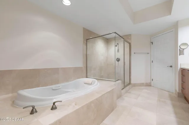a view of a kitchen with a refrigerator and a sink