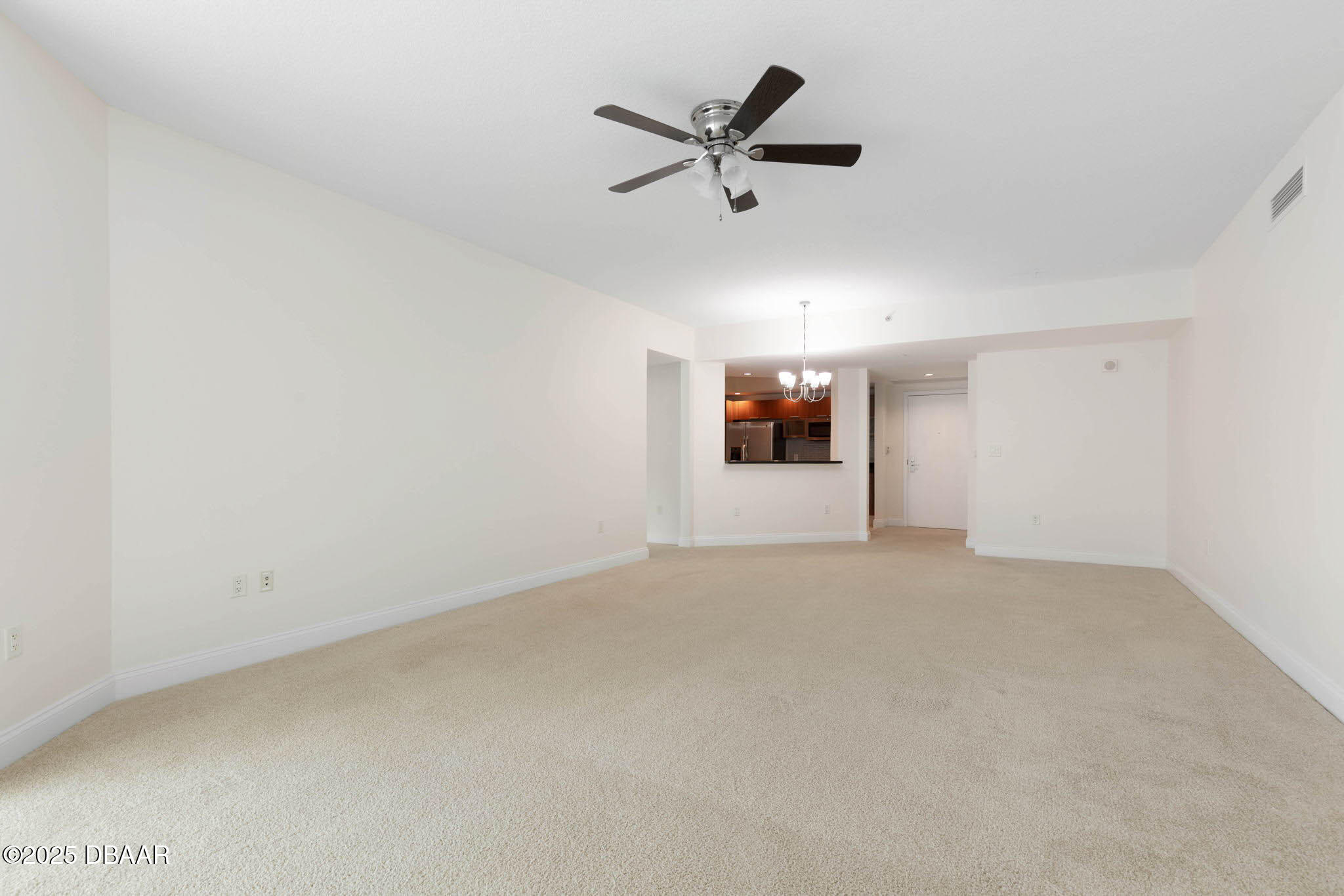 231 Riverside Drive, Unit 608 Holly Hill, FL 32117 - Photo 32 of 74 a view of a livingroom with a ceiling fan and window