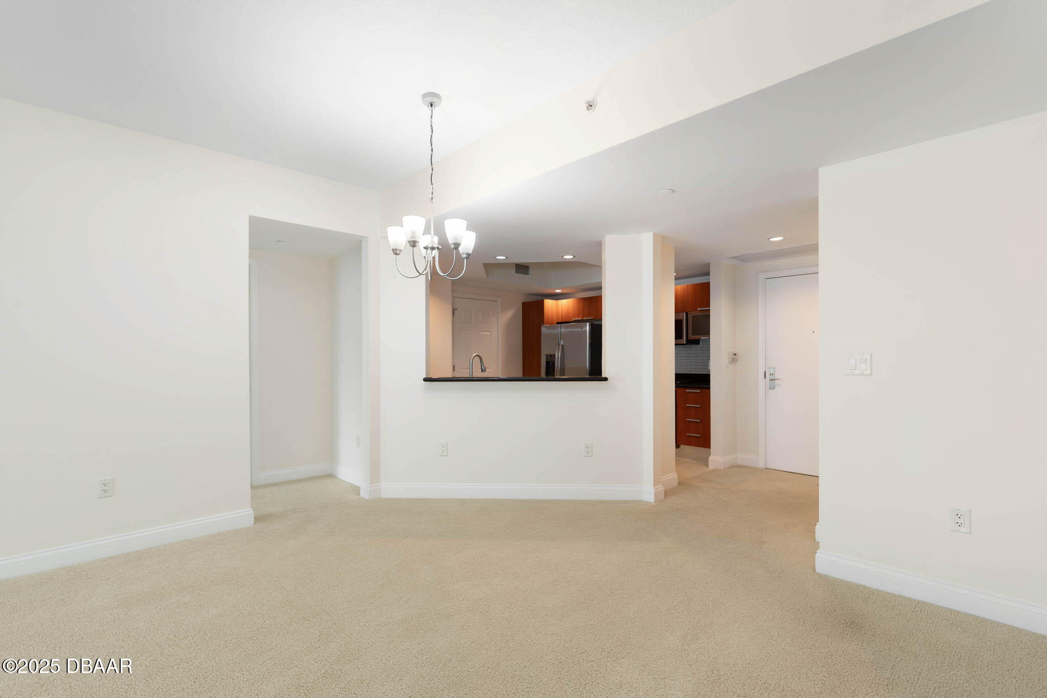 231 Riverside Drive, Unit 608 Holly Hill, FL 32117 - Photo 34 of 74 a view of a kitchen with a refrigerator and a sink