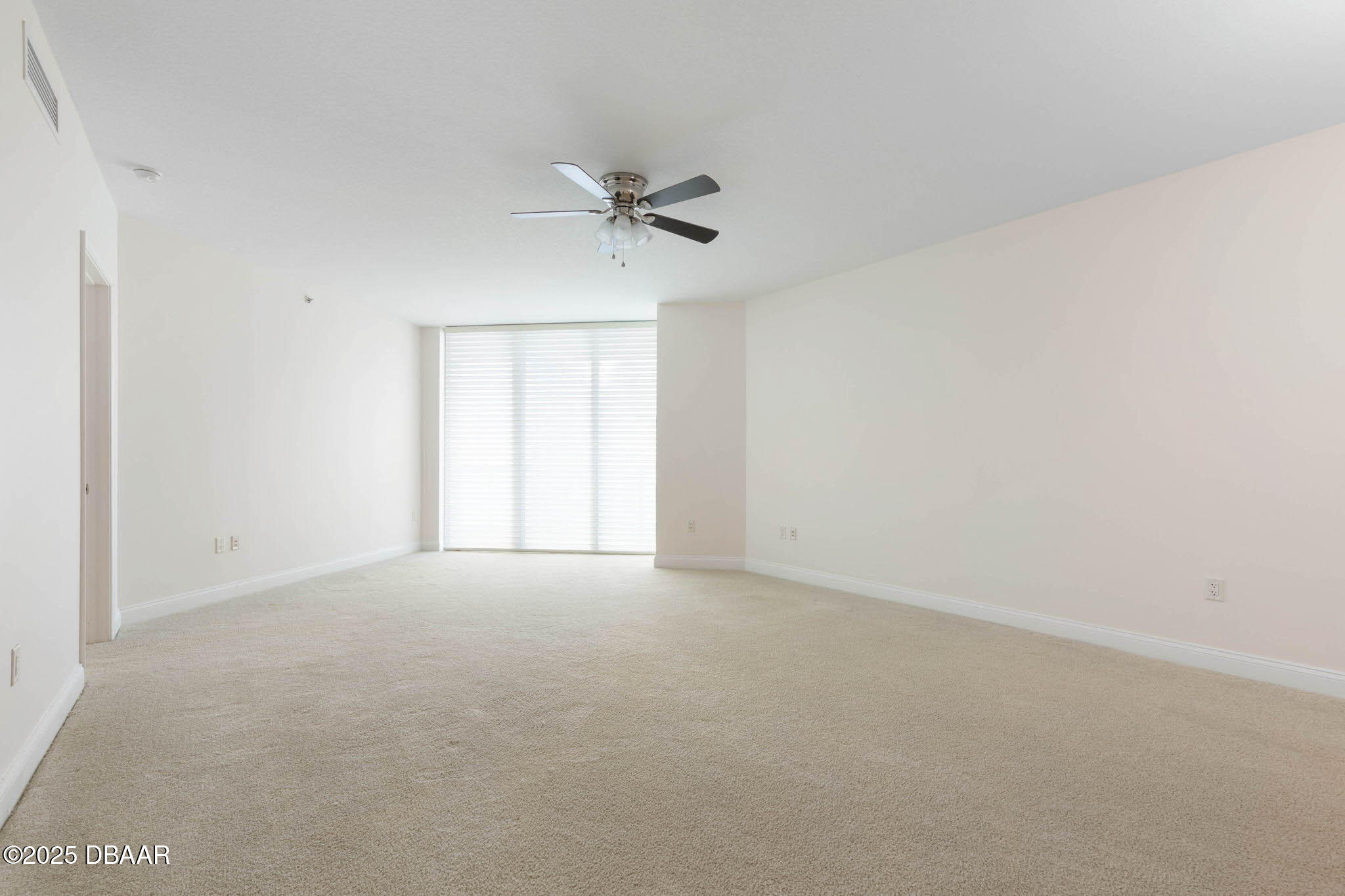 231 Riverside Drive, Unit 608 Holly Hill, FL 32117 - Photo 8 of 74 a view of empty room with ceiling fan