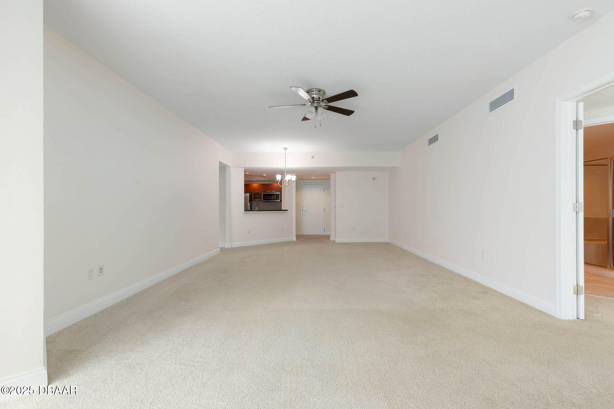 231 Riverside Drive, Unit 608 Holly Hill, FL 32117 - Photo 9 of 74 an empty room with a ceiling fan and a window