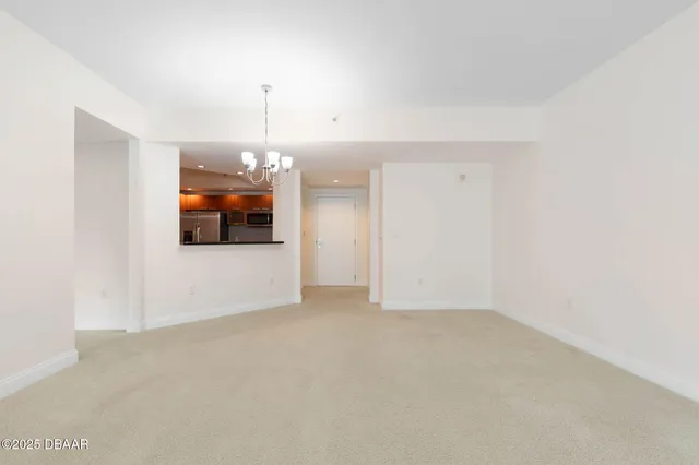 a kitchen with granite countertop a sink and cabinets