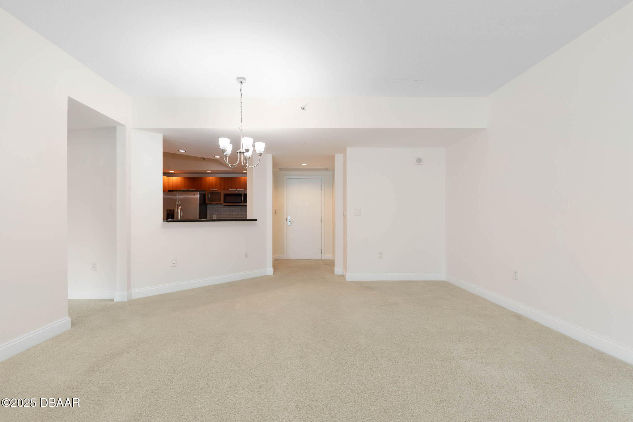 231 Riverside Drive, Unit 608 Holly Hill, FL 32117 - Photo 10 of 74 a view of an empty room with a fireplace