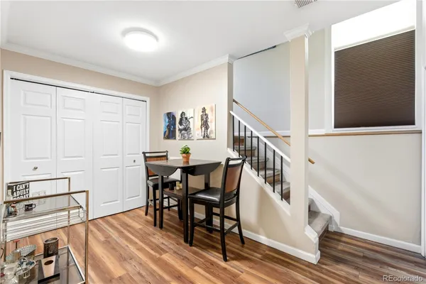 a view of a livingroom with furniture wooden floor and front door
