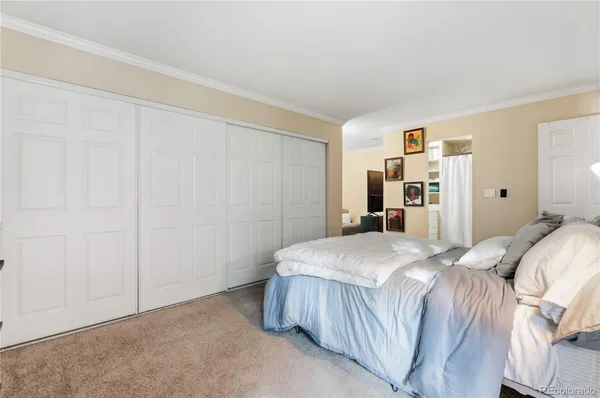 a bedroom with a bed and a cabinets
