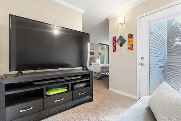 a room with furniture and a flat screen tv