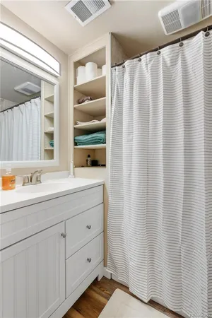 a bathroom with a double vanity sink and mirror