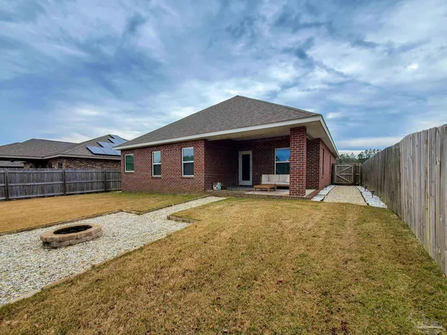 a view of a house with swimming pool and porch