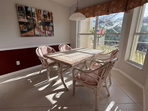 a kitchen with a sink a stove and cabinets