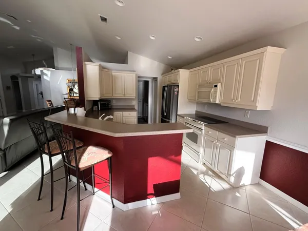 a bedroom with a bed and a mirror