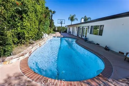 a view of balcony with wooden floor