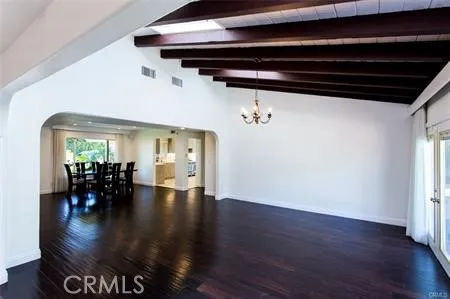 a view of dining room with wooden floor and seating space
