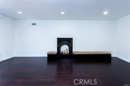 a view of living room with wooden floor