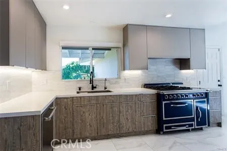 a kitchen with a stove and a sink