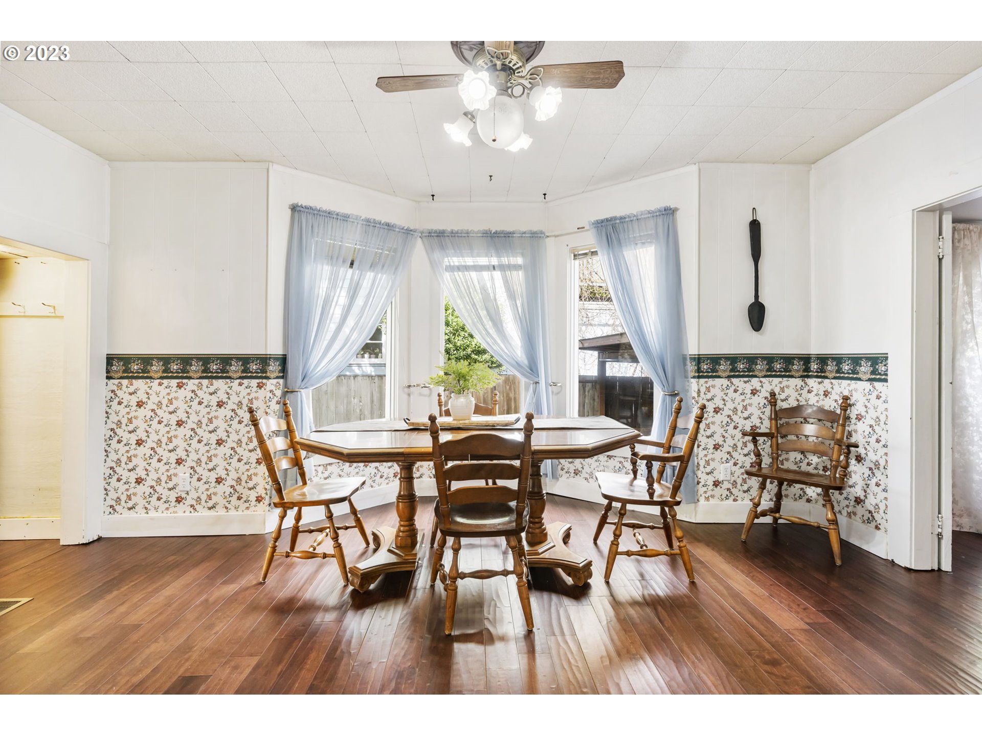 108 South 4th Avenue Ridgefield, WA 98642 - Photo 13 of 32 a view of a dining room with furniture and wooden floor