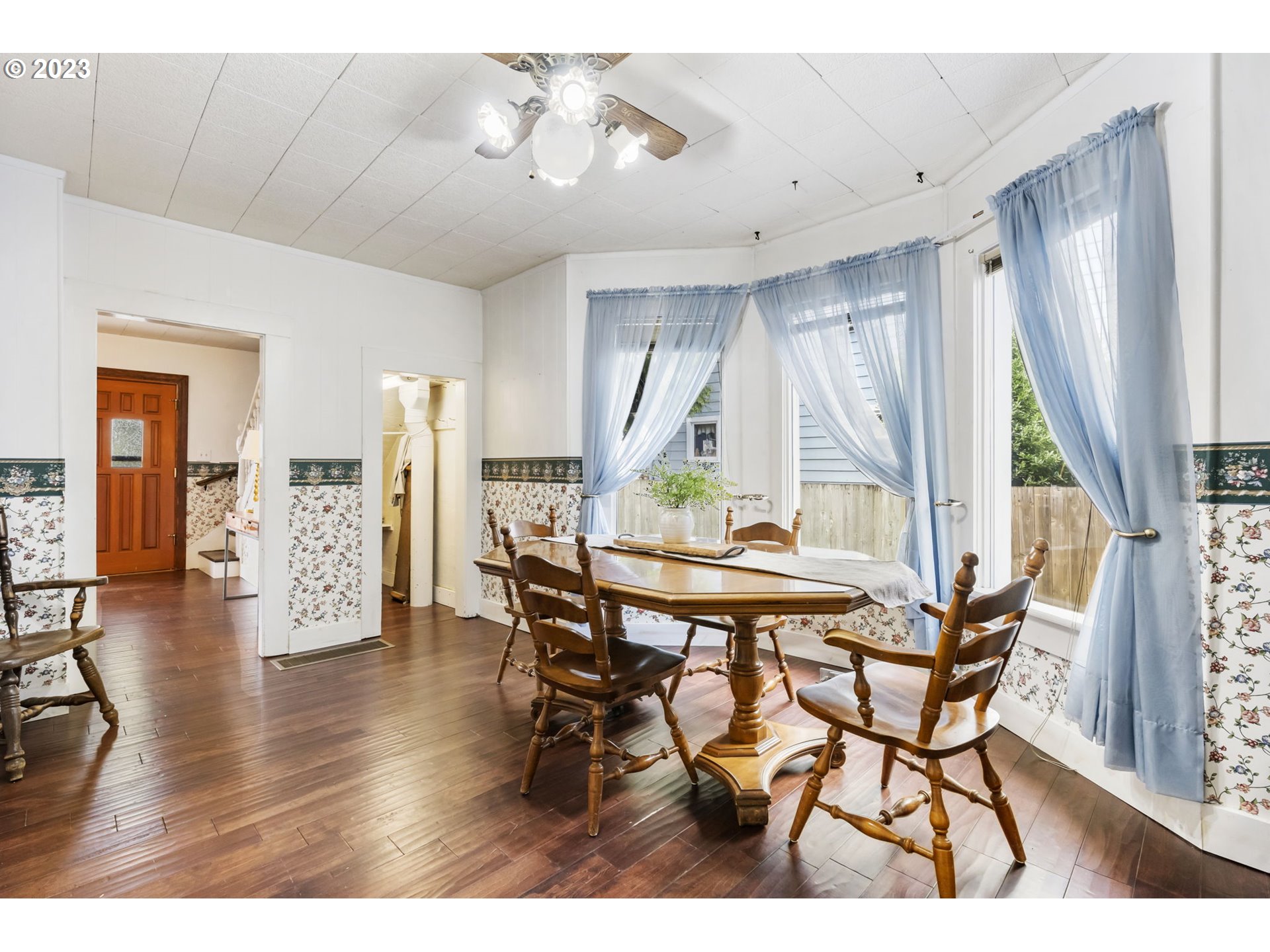 108 South 4th Avenue Ridgefield, WA 98642 - Photo 14 of 32 a view of a dining room with furniture and wooden floor