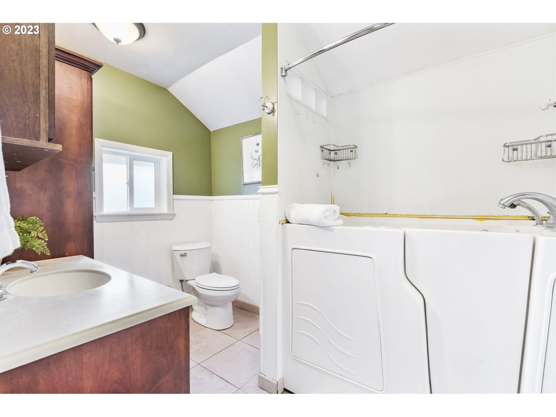 108 South 4th Avenue Ridgefield, WA 98642 - Photo 15 of 32 a bathroom with a sink vanity mirror and toilet